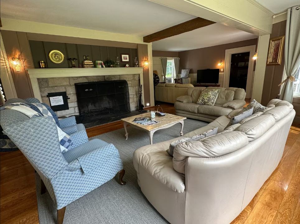 Rich valley estate living room with fireplace | Visit PA Great Outdoors